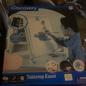 New in box.Not sure of size. wood and can be used on a table or sit on floor